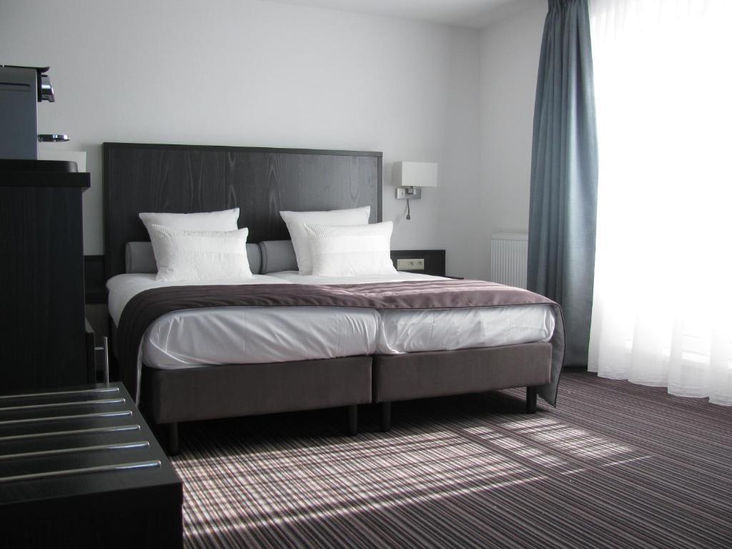 Boutique Hotel De Zwaluw De Koog  Quarto foto