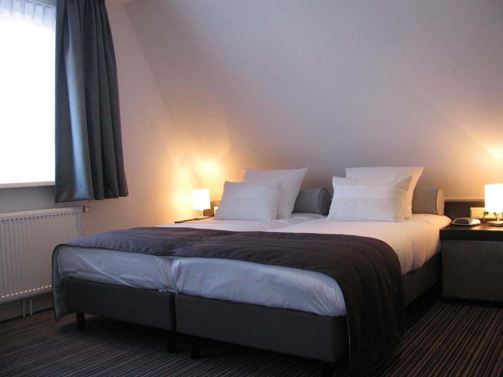 Boutique Hotel De Zwaluw De Koog  Quarto foto