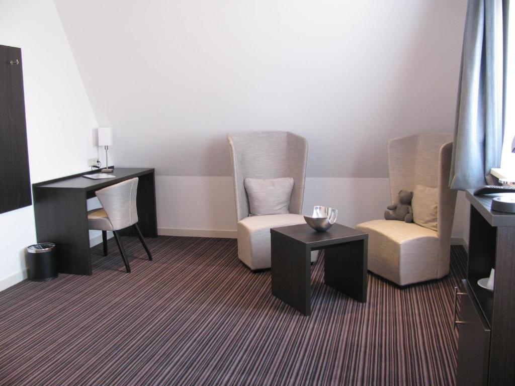 Boutique Hotel De Zwaluw De Koog  Quarto foto